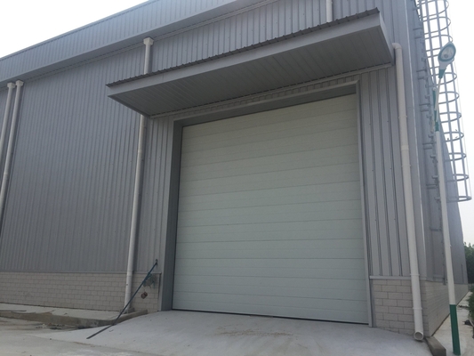 Prefab Steel Structural Workshop Warehouse Wind Resist With Electric Rolling Up Shutter